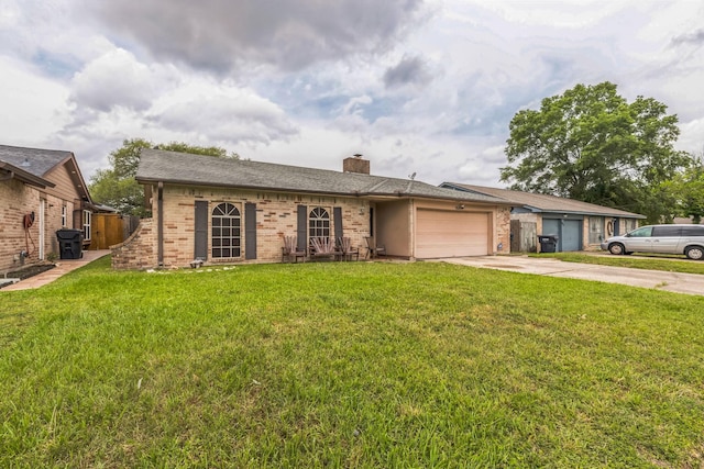 ranch-style home with a garage, a chimney, driveway, and brick siding