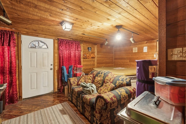 living room featuring wooden walls, wood ceiling, and hardwood / wood-style flooring