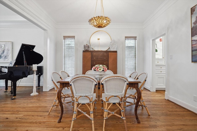 4122 University Blvd, Houston, TX 77005 - dining room featuring baseboards, ornamental molding, and light wood-style flooring