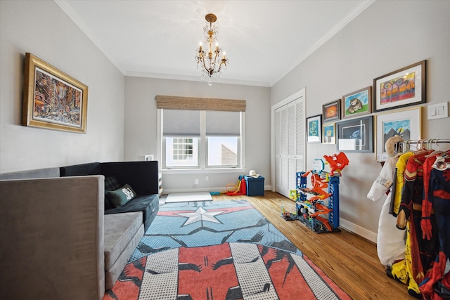 4122 University Blvd, Houston, TX 77005 - interior space with crown molding, baseboards, wood finished floors, and a chandelier