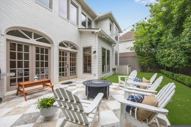 4122 University Blvd, Houston, TX 77005 - view of patio / terrace with fence, a fire pit, and french doors