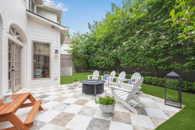 4122 University Blvd, Houston, TX 77005 - view of patio / terrace featuring french doors, a fenced backyard, and an outdoor fire pit