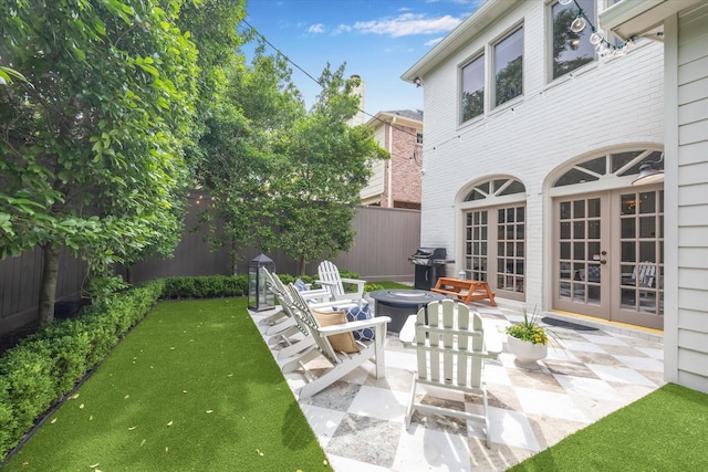 4122 University Blvd, Houston, TX 77005 - view of patio with a fenced backyard, grilling area, and french doors