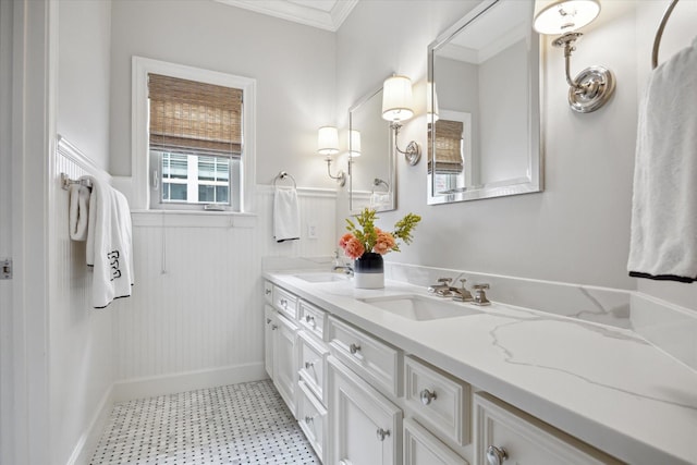 4122 University Blvd, Houston, TX 77005 - full bath with crown molding, double vanity, wainscoting, tile patterned floors, and a sink