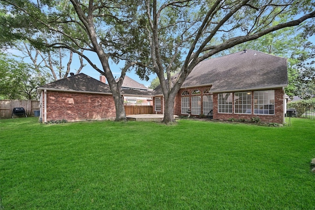 4319 Island Hills Dr, Pasadena, TX 77059 - back of house featuring brick siding and roof with shingles