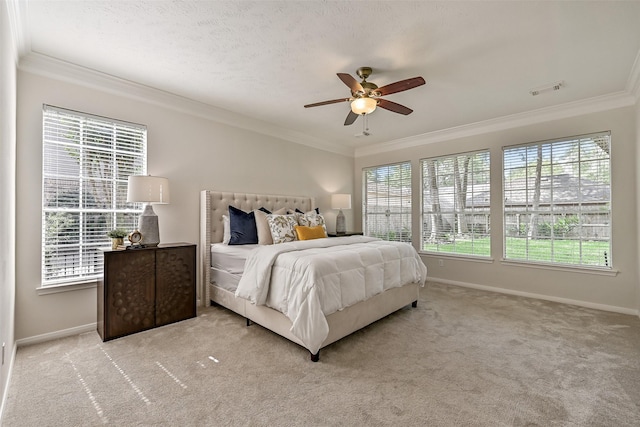 bedroom featuring crown molding, baseboards, and multiple windows