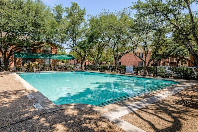 pool featuring fence