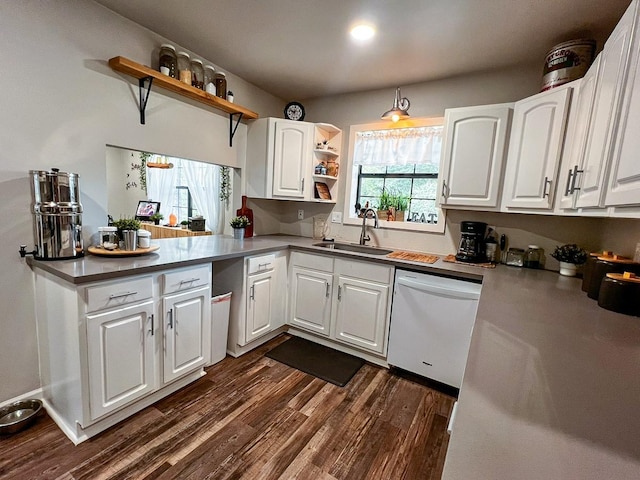 kitchen featuring dark wood-style flooring, open shelves, dishwasher, a sink, and white cabinets