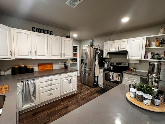 kitchen with white cabinetry, dark countertops, appliances with stainless steel finishes, and visible vents