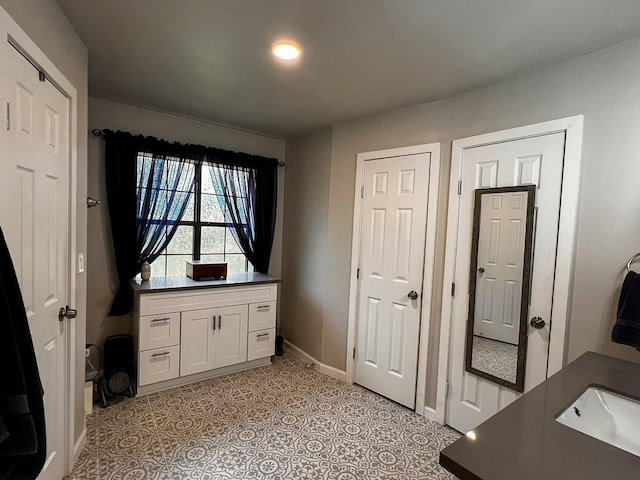 doorway to outside with baseboards