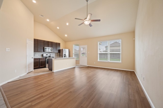 unfurnished living room with a ceiling fan, baseboards, recessed lighting, and light wood finished floors