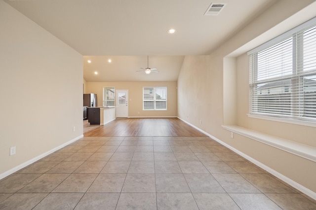 spare room featuring light tile patterned flooring, ceiling fan, recessed lighting, vaulted ceiling, and visible vents