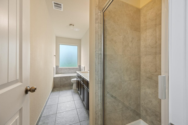 bathroom featuring tiled tub, visible vents, tile patterned flooring, a tile shower, and vanity