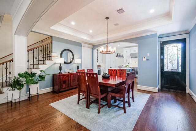 5336 Inker St, Houston, TX 77007 - dining room with stairway, baseboards, a raised ceiling, and dark wood-type flooring