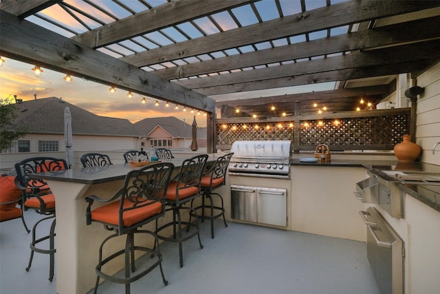 5336 Inker St, Houston, TX 77007 - view of patio with area for grilling, an outdoor kitchen, a pergola, and outdoor wet bar
