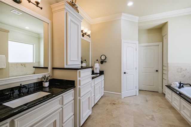 5336 Inker St, Houston, TX 77007 - bathroom featuring a garden tub, visible vents, two vanities, a sink, and ornamental molding