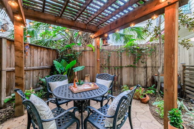 5336 Inker St, Houston, TX 77007 - view of patio featuring outdoor dining area, a fenced backyard, and a pergola