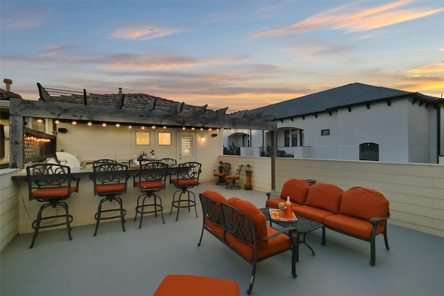 5336 Inker St, Houston, TX 77007 - patio terrace at dusk featuring a pergola and an outdoor hangout area