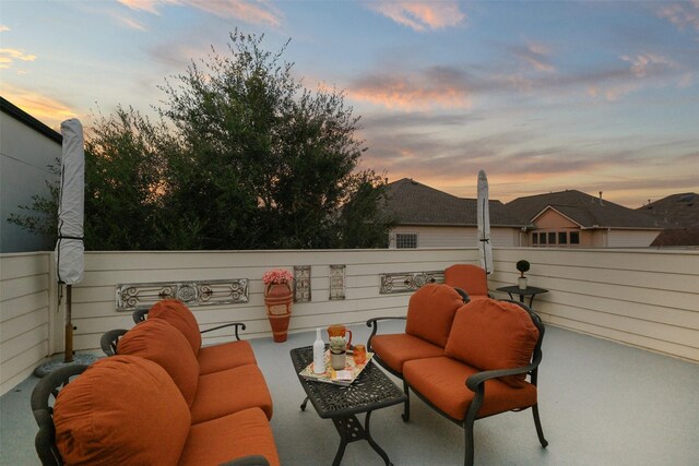 5336 Inker St, Houston, TX 77007 - patio terrace at dusk featuring a balcony and an outdoor hangout area