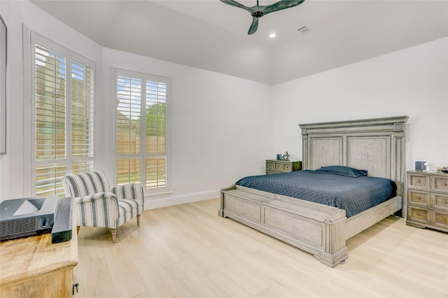 bedroom with a ceiling fan, visible vents, wood finished floors, baseboards, and recessed lighting