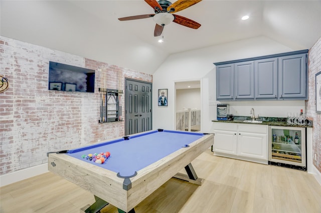 recreation room featuring light wood-style flooring, wet bar, wine cooler, and lofted ceiling