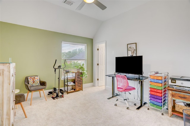 home office featuring a ceiling fan, visible vents, baseboards, lofted ceiling, and carpet