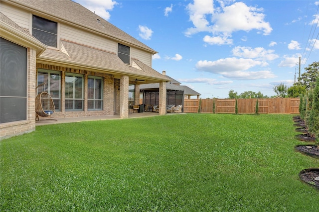 view of yard with a patio and fence