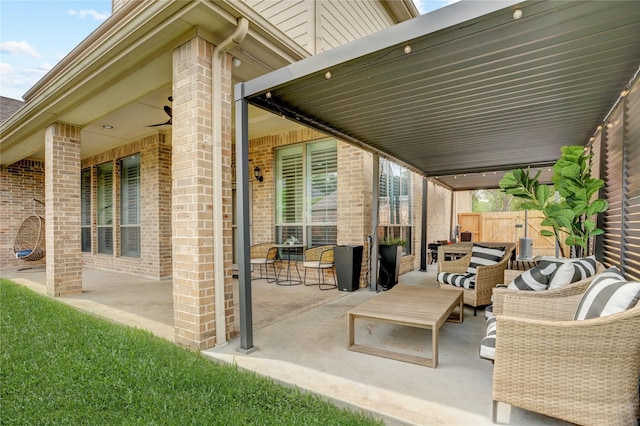 view of patio with fence and an outdoor hangout area