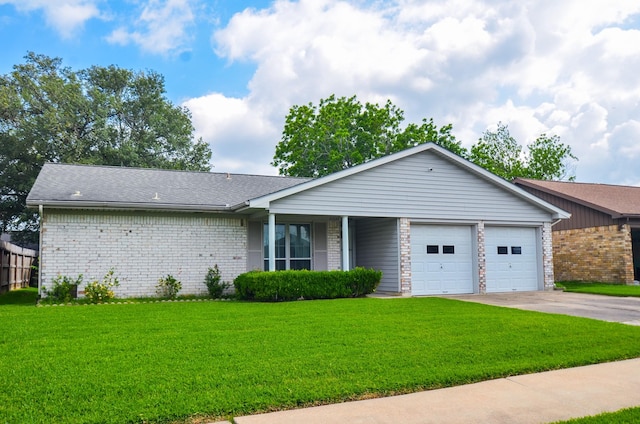 ranch-style house with brick siding, driveway, a front lawn, and a garage
