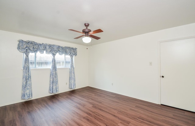 empty room with ceiling fan and wood finished floors