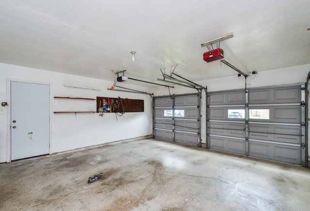 garage featuring a garage door opener