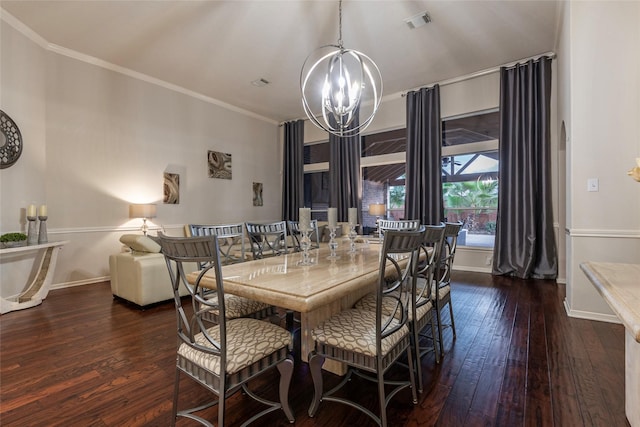 dining area with crown molding, baseboards, hardwood / wood-style flooring, and a notable chandelier