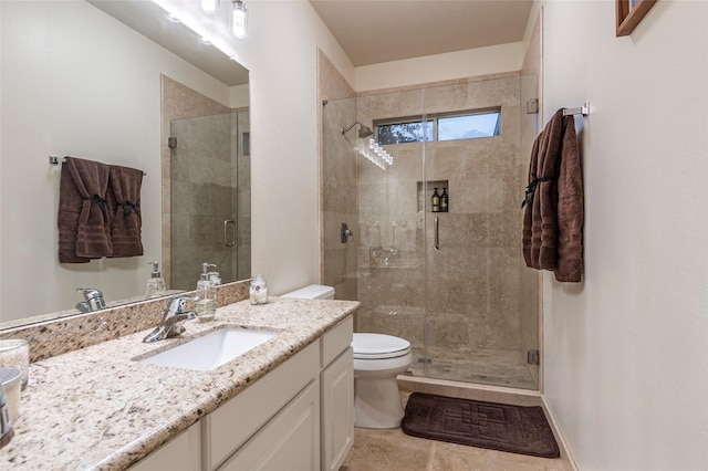 full bathroom with vanity, toilet, and a shower stall