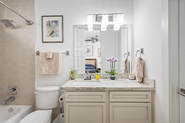 ensuite bathroom with vanity, bathing tub / shower combination, toilet, ceiling fan, and connected bathroom