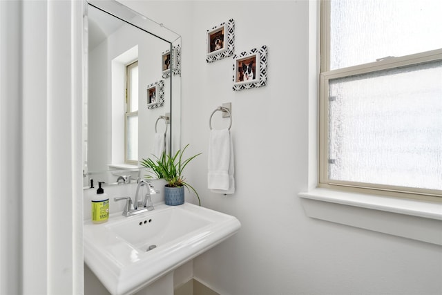 bathroom with a sink and a healthy amount of sunlight