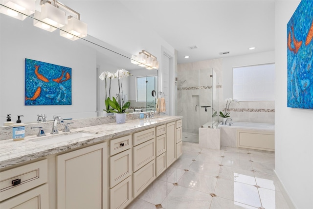 bathroom featuring a garden tub, a shower stall, a sink, tile patterned floors, and recessed lighting
