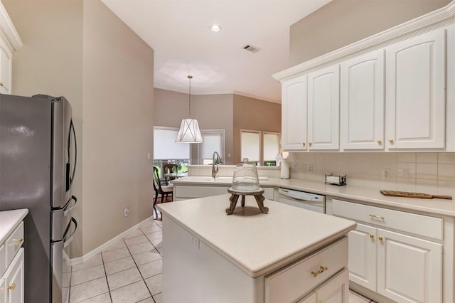 kitchen with dishwasher, a center island, freestanding refrigerator, white cabinetry, and a peninsula