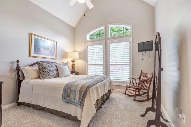 bedroom featuring a ceiling fan, baseboards, light colored carpet, and high vaulted ceiling