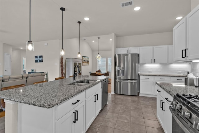kitchen featuring backsplash, visible vents, a sink, stainless steel appliances, and recessed lighting