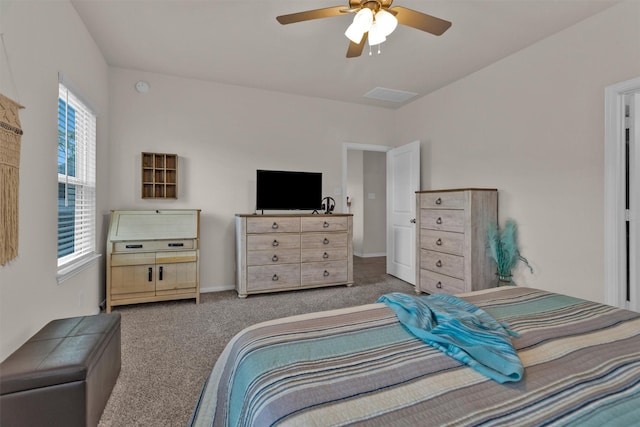 bedroom featuring baseboards, ceiling fan, and carpet