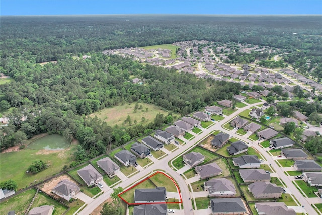 aerial view with a residential view and a wooded view