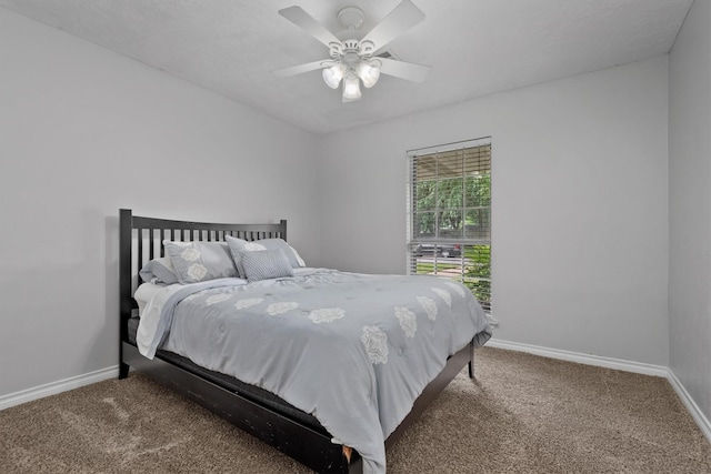 227 Oak Hollow St, Conroe, TX 77301 - bedroom with baseboards, ceiling fan, and carpet flooring