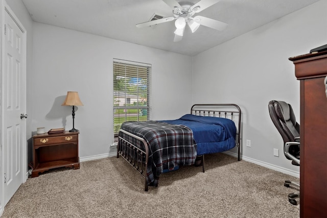227 Oak Hollow St, Conroe, TX 77301 - bedroom with carpet floors, baseboards, and ceiling fan