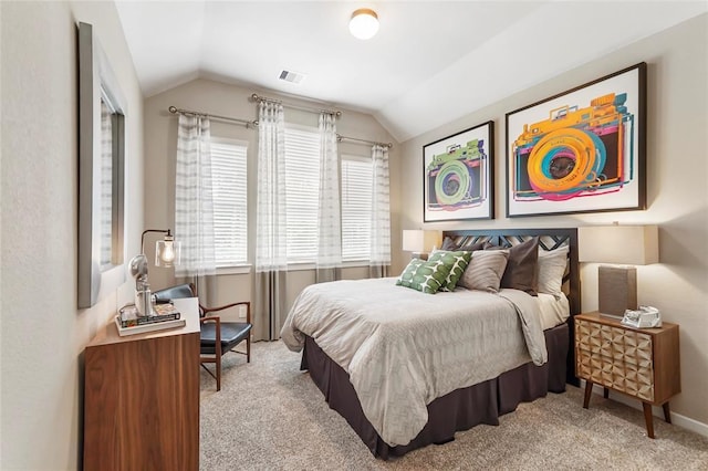 carpeted bedroom featuring visible vents and lofted ceiling
