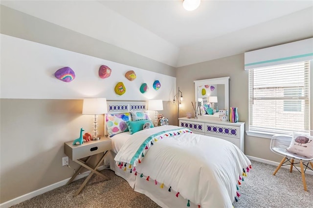 carpeted bedroom with baseboards and lofted ceiling