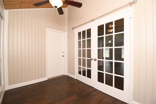 interior space with a ceiling fan, french doors, and dark wood-style floors