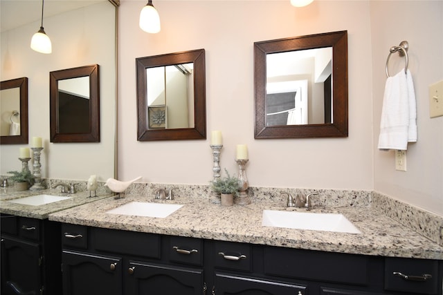 full bath featuring a sink and double vanity