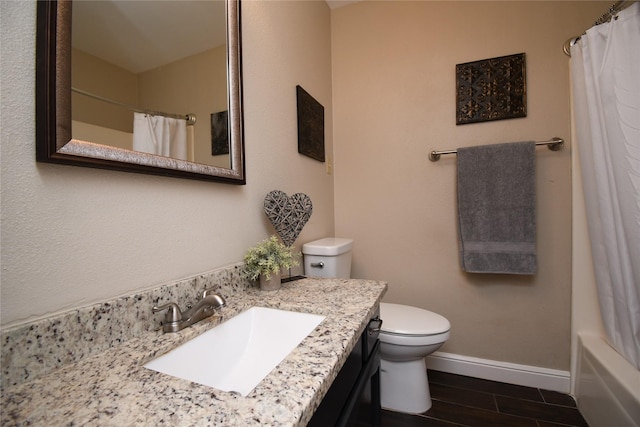 full bathroom featuring baseboards, wood tiled floor, vanity, and toilet