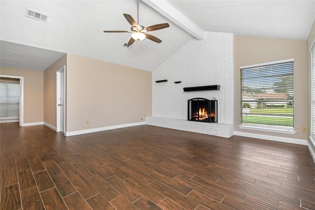 unfurnished living room with a ceiling fan, visible vents, a fireplace, baseboards, and dark wood-style floors