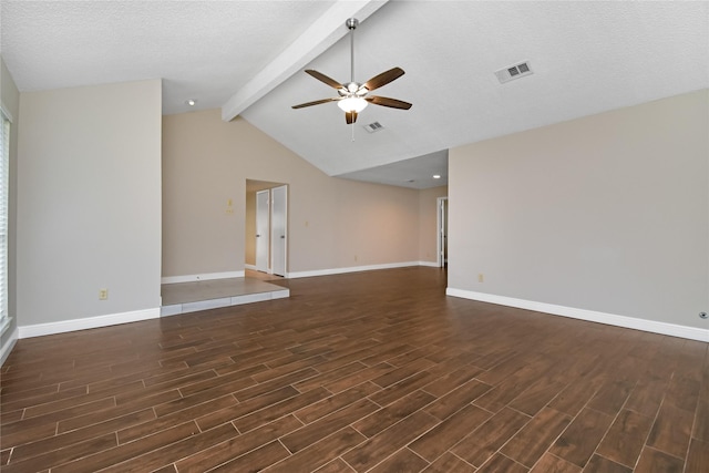 spare room featuring dark wood-style flooring, a ceiling fan, baseboards, vaulted ceiling with beams, and visible vents